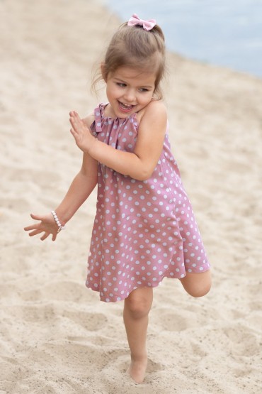 TRAPEZOID PINK POLKA DOT DRESS FOR A GIRL WITH BINDING